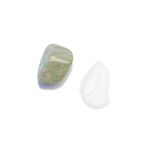 Terpenic livium circulation boosting lotion product swatch with amazonite crystal 